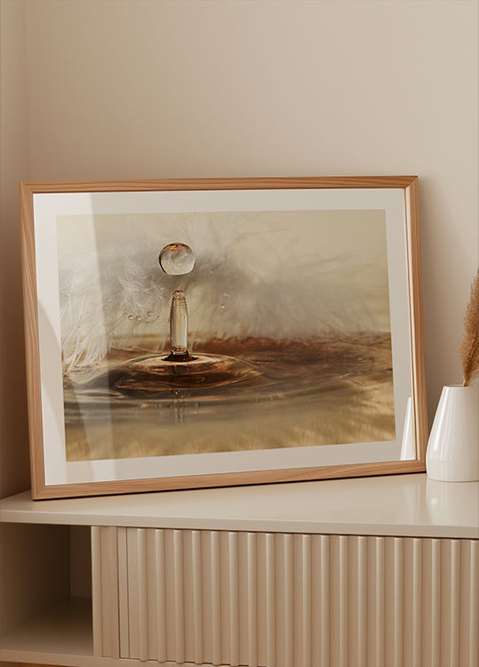 Goldene Federtropfen