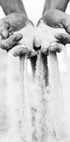 Sand Falling From Hands (B&W) Poster - Posterbox.dk