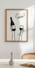 Hands holding a wine bottle and a wine glass with the text "Cheers!" in French Plakat - Posterbox